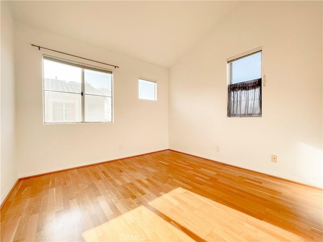 1628 E Palm Ave Unit 5, El Segundo, CA 90245 - spare room featuring light wood-style flooring and vaulted ceiling