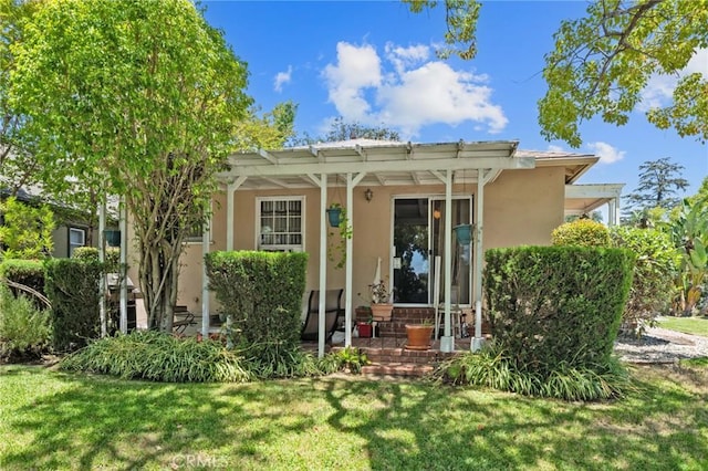 35 Columbia St, Pasadena, CA 91105 - back of property featuring stucco siding and a yard