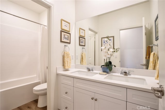 33084 Toledo Bend Ct, Winchester, CA 92596 - bathroom featuring double vanity, wood finished floors, and shower / bath combination with curtain