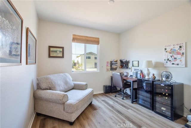 33084 Toledo Bend Ct, Winchester, CA 92596 - home office with light wood-type flooring and beverage cooler
