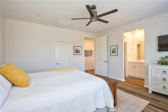 33084 Toledo Bend Ct, Winchester, CA 92596 - bedroom with wood finished floors, ensuite bath, and a ceiling fan