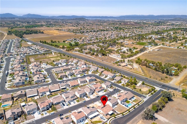 33084 Toledo Bend Ct, Winchester, CA 92596 - aerial view of property's location featuring a mountain backdrop and nearby suburban area