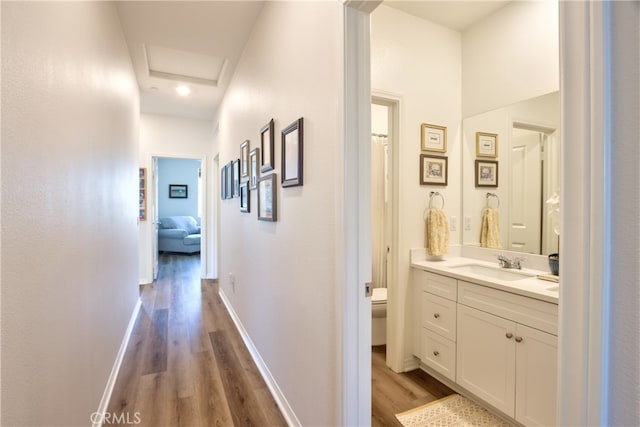 33084 Toledo Bend Ct, Winchester, CA 92596 - hallway with wood finished floors and attic access