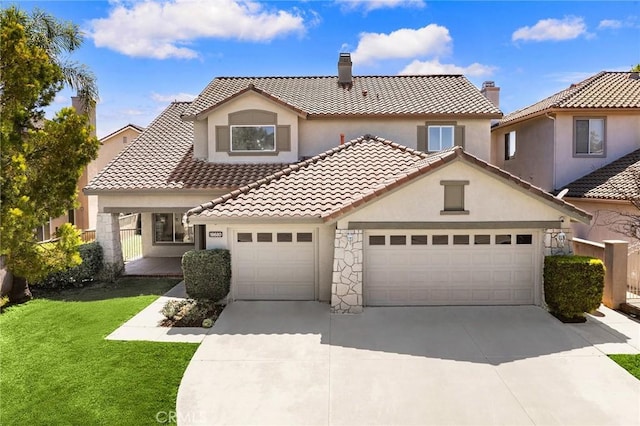 18680 Vantage Pointe Dr, Rowland Heights, CA 91748 - mediterranean / spanish-style house with driveway, an attached garage, stucco siding, a front lawn, and a tiled roof