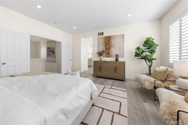 18680 Vantage Pointe Dr, Rowland Heights, CA 91748 - bedroom with light wood-style flooring, recessed lighting, and ensuite bathroom