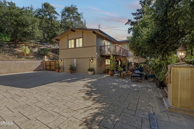 2100 Valley Meadow Dr, Oak View, CA 93022 - view of front of house with a balcony, a patio, a gate, and stucco siding