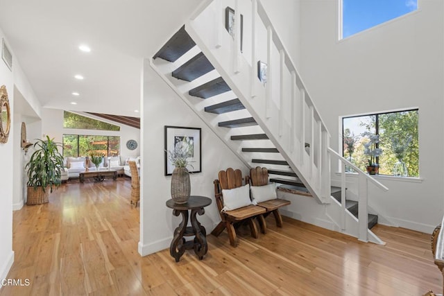2100 Valley Meadow Dr, Oak View, CA 93022 - stairs with plenty of natural light, high vaulted ceiling, wood-type flooring, and recessed lighting
