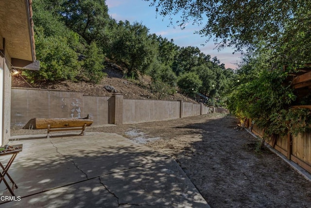 2100 Valley Meadow Dr, Oak View, CA 93022 - yard at dusk with a patio and a fenced backyard