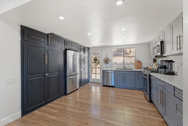 2100 Valley Meadow Dr, Oak View, CA 93022 - kitchen featuring appliances with stainless steel finishes, light wood finished floors, light countertops, and recessed lighting