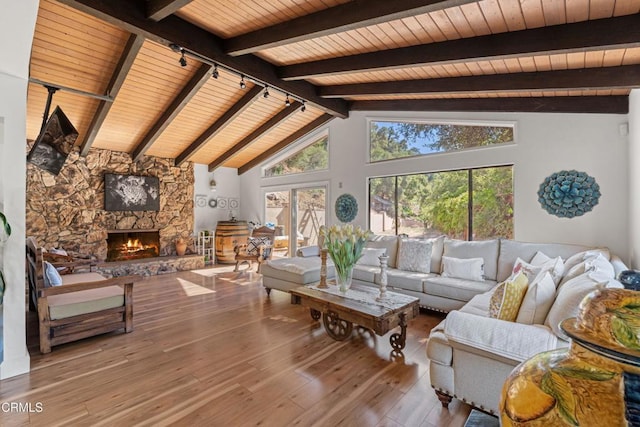 2100 Valley Meadow Dr, Oak View, CA 93022 - living area featuring wooden ceiling, wood-type flooring, track lighting, and a stone fireplace