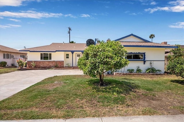 11251 Bowles Ave, Garden Grove, CA 92841 - ranch-style house with a front lawn, driveway, brick siding, and stucco siding
