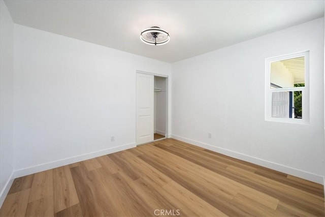 11251 Bowles Ave, Garden Grove, CA 92841 - unfurnished bedroom with light wood-style flooring and a closet