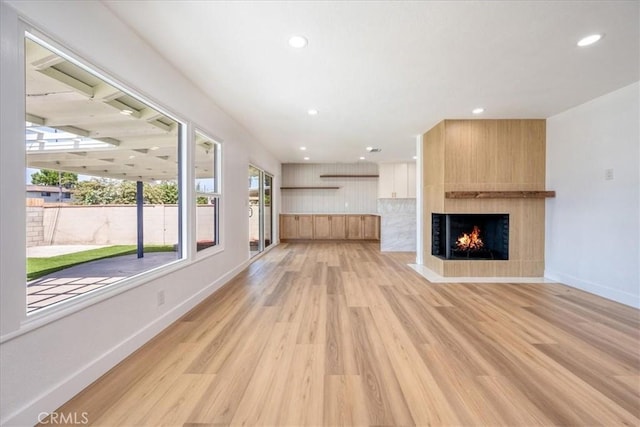 11251 Bowles Ave, Garden Grove, CA 92841 - unfurnished living room featuring light wood-style floors, a large fireplace, and recessed lighting