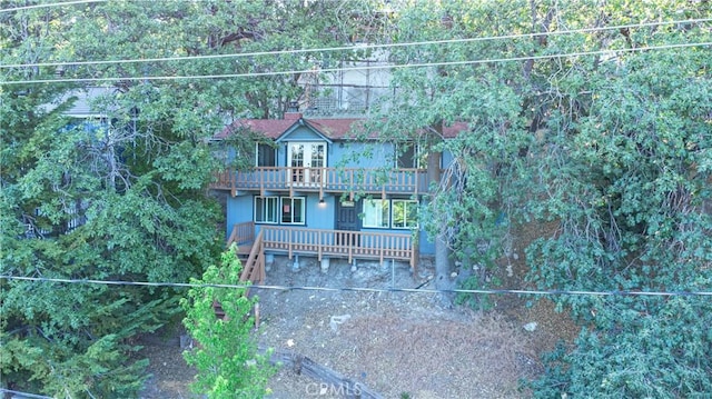 31954 Pine Cone Dr, Running Springs, CA 92382 - view of front facade with a wooden deck
