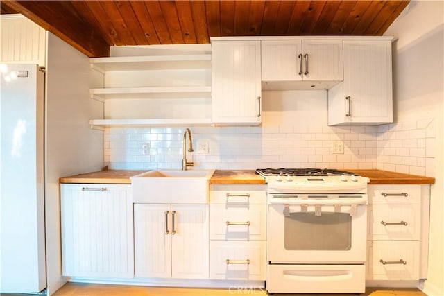 31954 Pine Cone Dr, Running Springs, CA 92382 - kitchen with white appliances, wood ceiling, tasteful backsplash, wooden counters, and white cabinetry