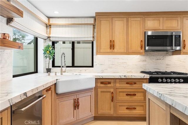 1817 W Bay Ave Unit A, Newport Beach, CA 92663 - kitchen with stainless steel appliances, light stone countertops, and tasteful backsplash