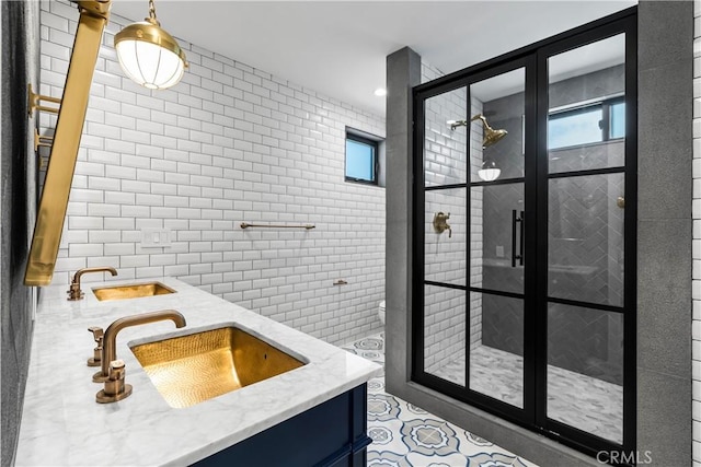1817 W Bay Ave Unit A, Newport Beach, CA 92663 - full bathroom featuring double vanity, a shower stall, plenty of natural light, and tile walls