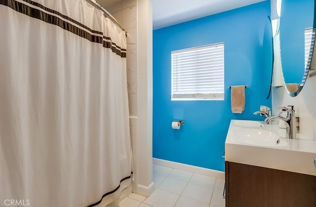 12826 Bombardier Ave, Norwalk, CA 90650 - full bathroom featuring double vanity, tile patterned floors, and a shower with shower curtain