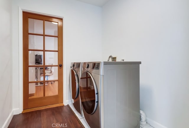 12826 Bombardier Ave, Norwalk, CA 90650 - washroom with independent washer and dryer and dark wood finished floors