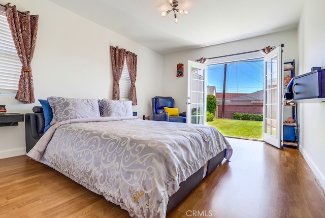 12826 Bombardier Ave, Norwalk, CA 90650 - bedroom featuring wood finished floors, access to outside, and french doors