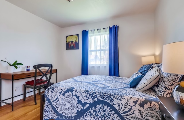 12826 Bombardier Ave, Norwalk, CA 90650 - bedroom with wood finished floors