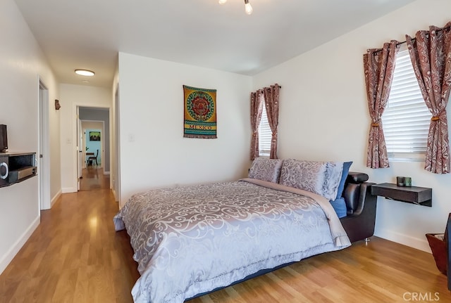 12826 Bombardier Ave, Norwalk, CA 90650 - bedroom featuring wood finished floors