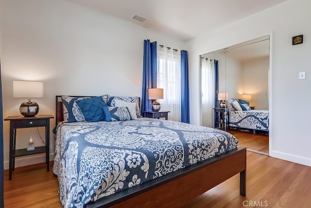 12826 Bombardier Ave, Norwalk, CA 90650 - bedroom with wood finished floors and a closet