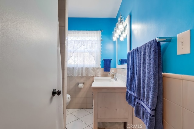 12826 Bombardier Ave, Norwalk, CA 90650 - bathroom featuring vanity, tile patterned flooring, and tile walls