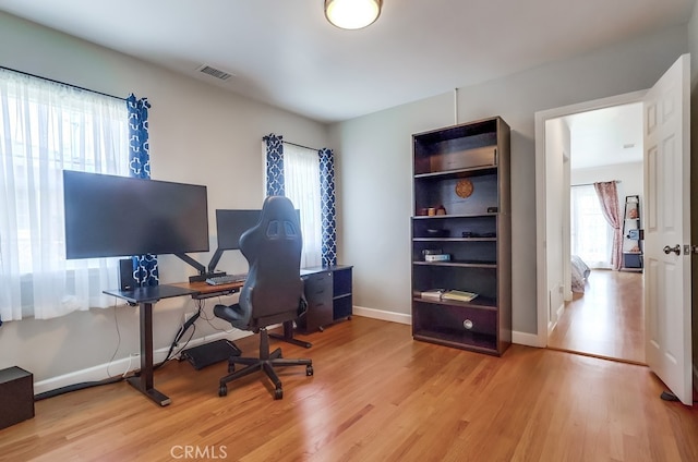 12826 Bombardier Ave, Norwalk, CA 90650 - office featuring wood finished floors and baseboards