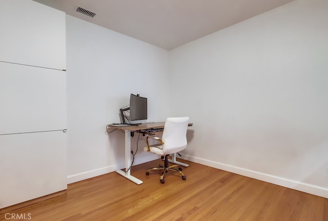 12826 Bombardier Ave, Norwalk, CA 90650 - office area with wood finished floors and baseboards