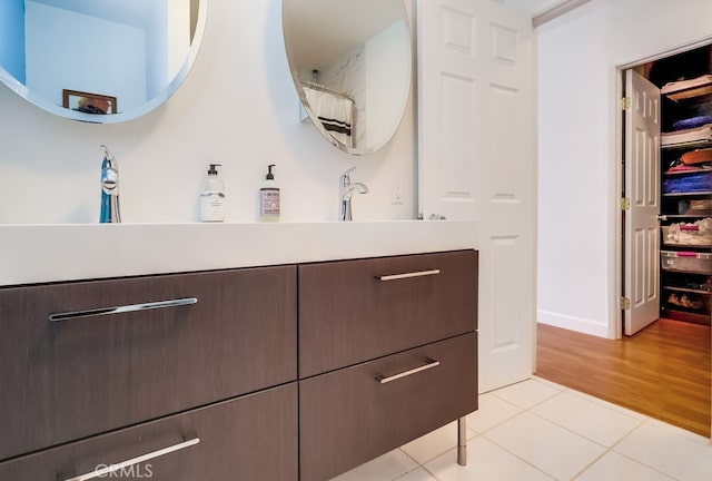 12826 Bombardier Ave, Norwalk, CA 90650 - bathroom featuring tile patterned floors and vanity