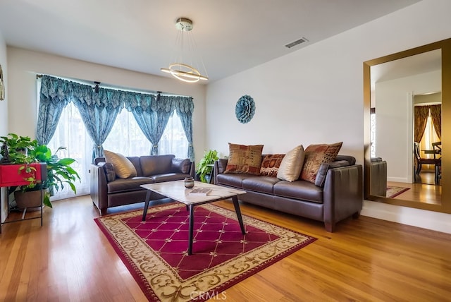 12826 Bombardier Ave, Norwalk, CA 90650 - living area with wood finished floors