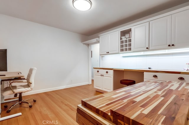 12826 Bombardier Ave, Norwalk, CA 90650 - office area featuring light wood-style floors and baseboards
