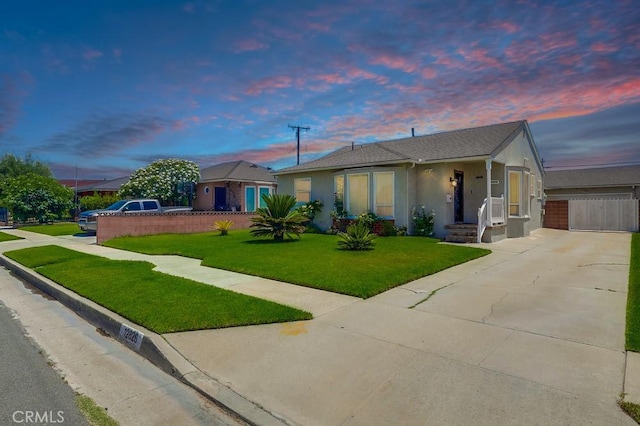 12826 Bombardier Ave, Norwalk, CA 90650 - view of front of house featuring concrete driveway and stucco siding