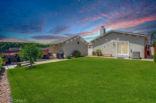 12826 Bombardier Ave, Norwalk, CA 90650 - back of house with a chimney, french doors, a patio, and stucco siding
