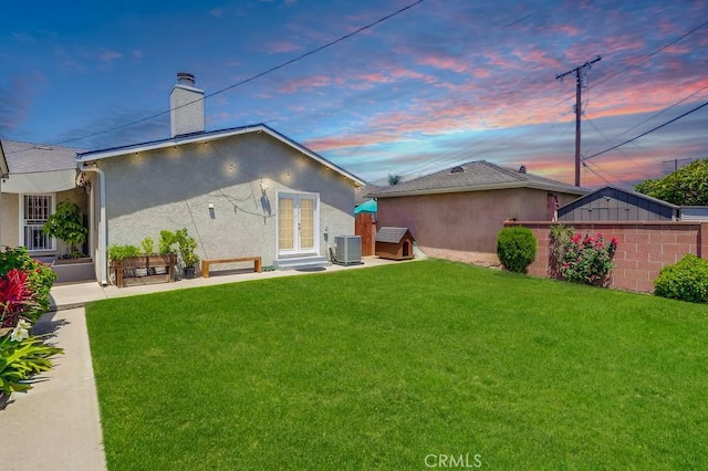 12826 Bombardier Ave, Norwalk, CA 90650 - rear view of property with a chimney, stucco siding, french doors, and a patio