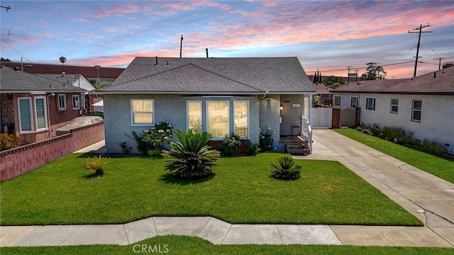 12826 Bombardier Ave, Norwalk, CA 90650 - bungalow-style home with stucco siding, roof with shingles, a gate, and driveway