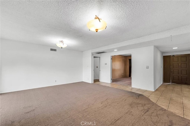 13624 Vose St, Valley Glen, CA 91405 - carpeted empty room featuring a textured ceiling and tile patterned flooring