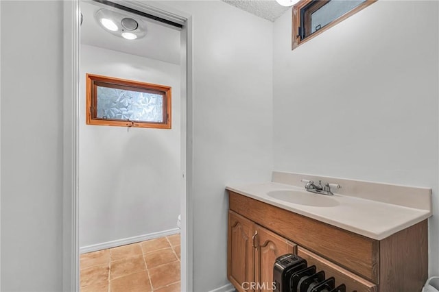 13624 Vose St, Valley Glen, CA 91405 - bathroom featuring vanity, tile patterned flooring, and a textured ceiling