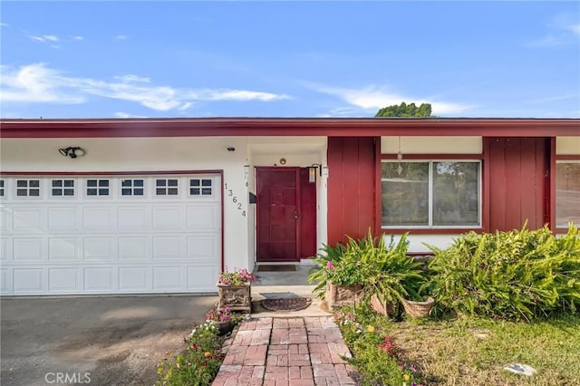 13624 Vose St, Valley Glen, CA 91405 - view of front of property with board and batten siding and an attached garage