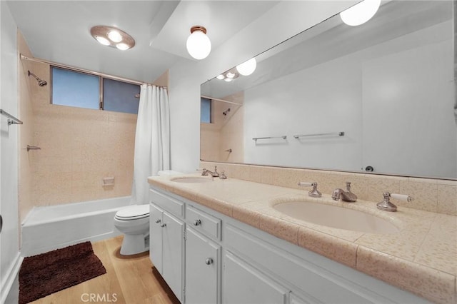 13624 Vose St, Valley Glen, CA 91405 - bathroom with shower / bath combo, double vanity, and wood finished floors