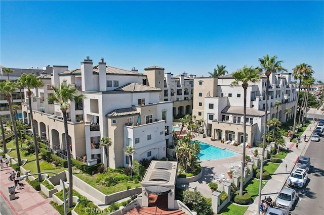 200 Pacific Coast Unit 130, Huntington Beach, CA 92648 - view of building exterior with a residential view and a community pool