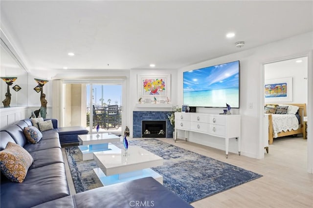 200 Pacific Coast Unit 130, Huntington Beach, CA 92648 - living area featuring wood finished floors, a fireplace, and recessed lighting