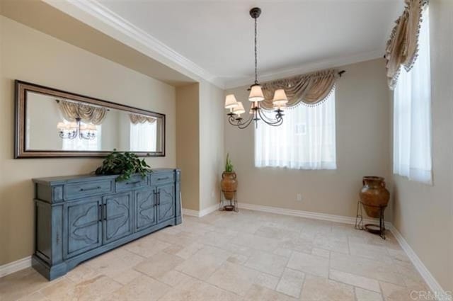 2792 Rambling Vistas Rd, Chula Vista, CA 91915 - unfurnished dining area with a chandelier, stone tile floors, and ornamental molding