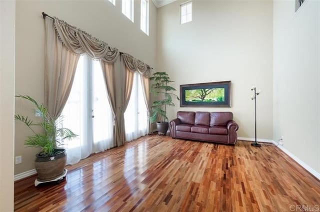 2792 Rambling Vistas Rd, Chula Vista, CA 91915 - living area with wood finished floors, a high ceiling, and crown molding