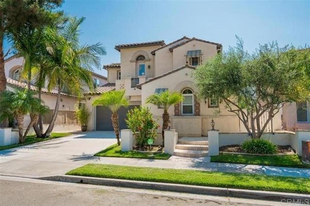 2792 Rambling Vistas Rd, Chula Vista, CA 91915 - mediterranean / spanish-style home featuring stucco siding, concrete driveway, and an attached garage