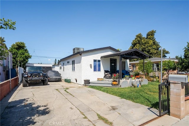 11001 Duncan Ave, Lynwood, CA 90262 - view of front facade featuring stucco siding and driveway