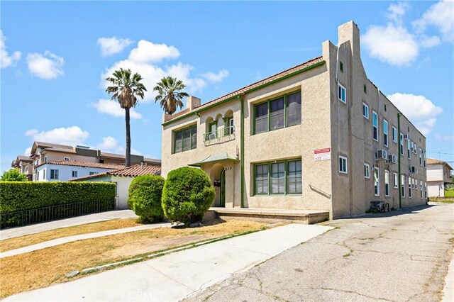 213 S Atlantic Blvd, Alhambra, CA 91801 - view of front of home with a chimney and stucco siding