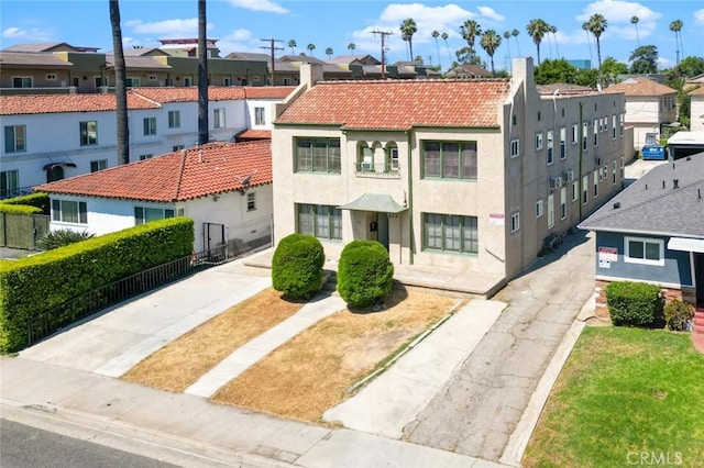 213 S Atlantic Blvd, Alhambra, CA 91801 - view of front of home featuring a residential view, stucco siding, a tiled roof, and a chimney