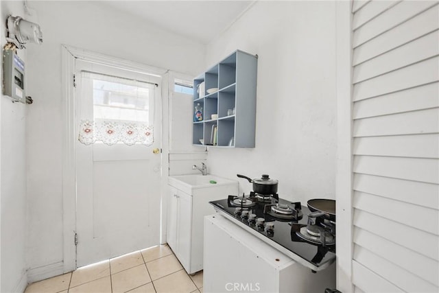 213 S Atlantic Blvd, Alhambra, CA 91801 - laundry area with a sink and light tile patterned floors